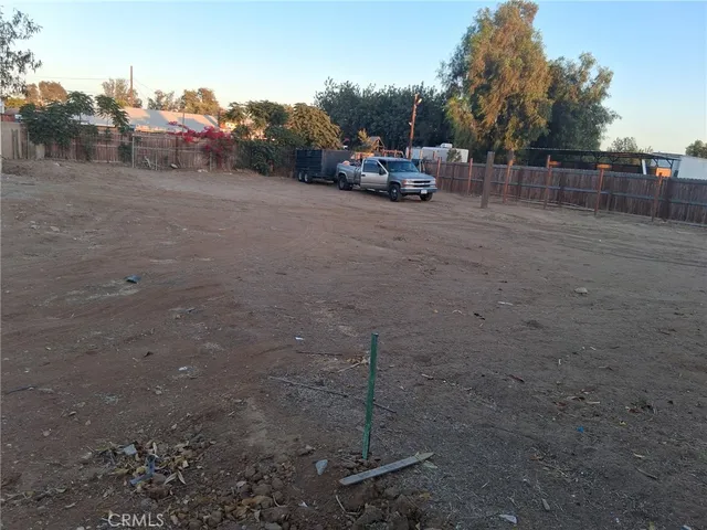 a view of street with parked cars