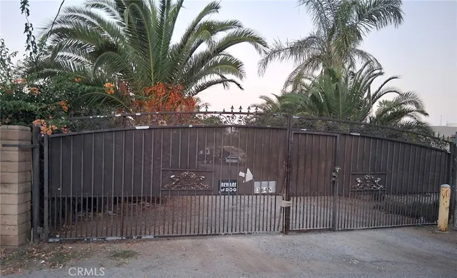 a view of a wrought iron fences in front of house