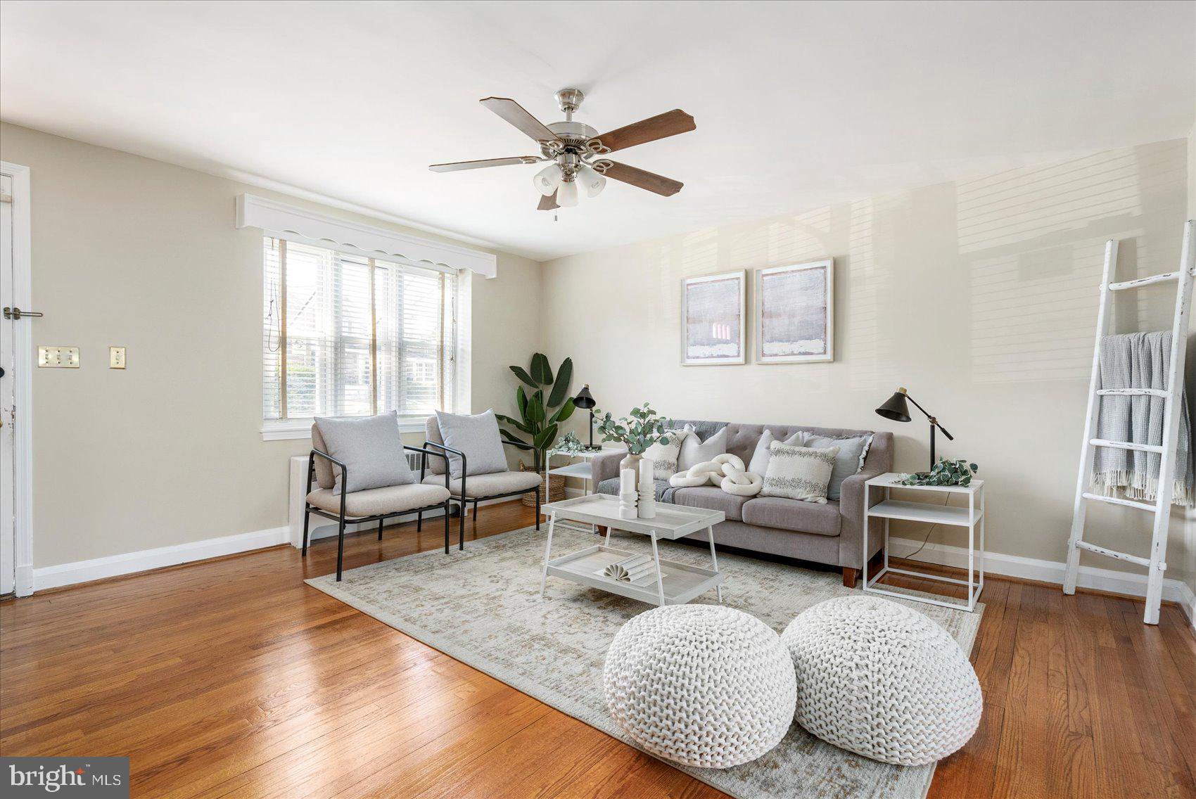 3809 Monterey Road Baltimore, MD 21218 - Photo 3 of 38 a living room with furniture and a wooden floor