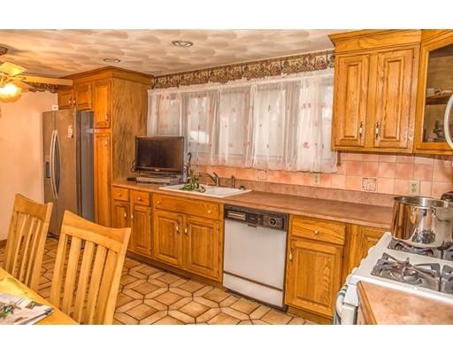 37 Gerald Street Springfield, MA 01109 - Photo 7 of 30 a kitchen with stainless steel appliances granite countertop a refrigerator and a stove top oven