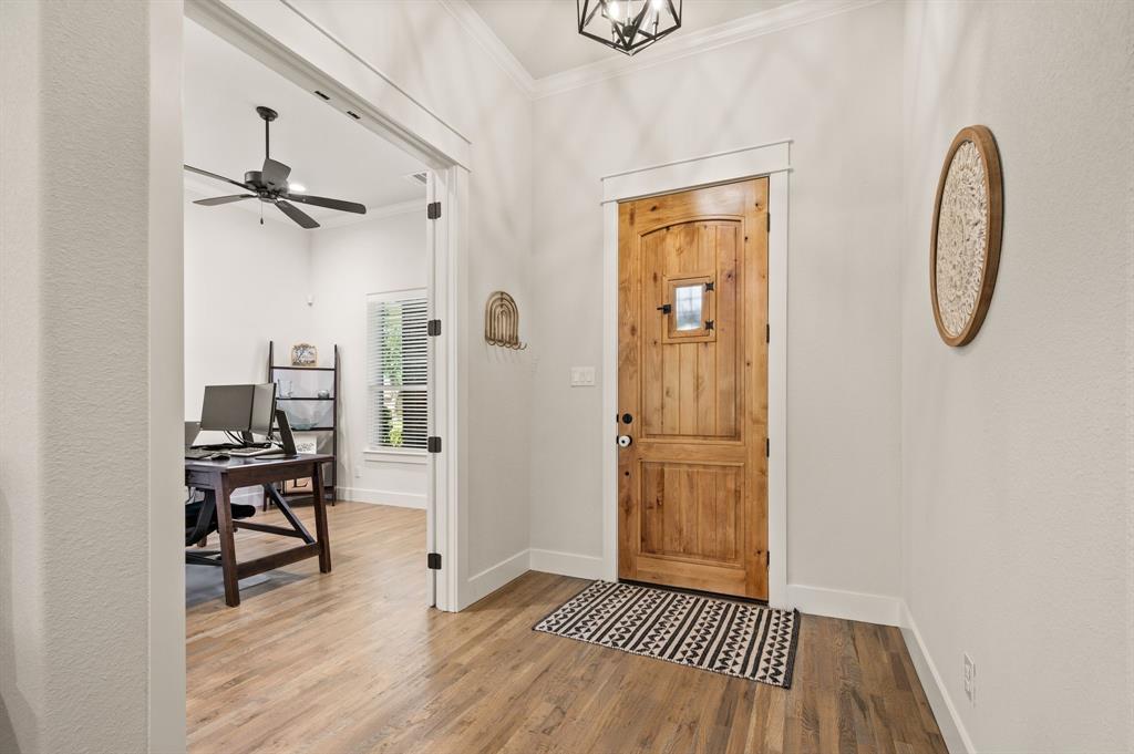 200 Clayton Crossing Springtown, TX 76082 - Photo 4 of 40 a view of a room with wooden floor and white walls