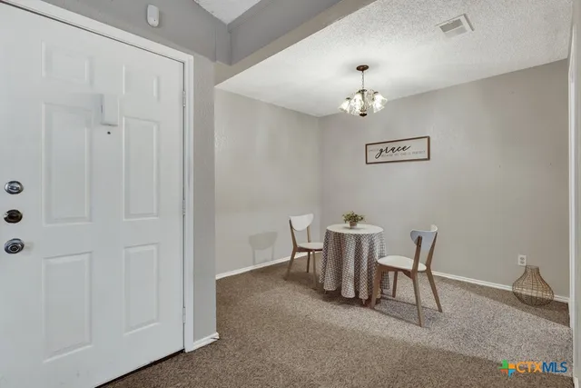 a view of a dining room with furniture