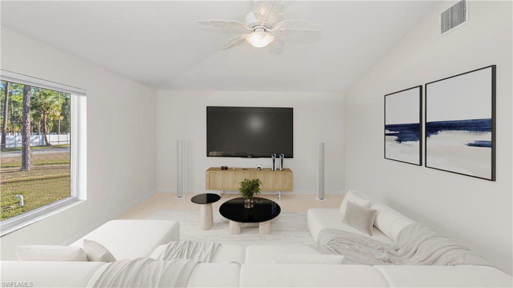 1580 16th Street Northeast Naples, FL 34120 - Photo 15 of 50 a bedroom with a bed and a flat screen tv