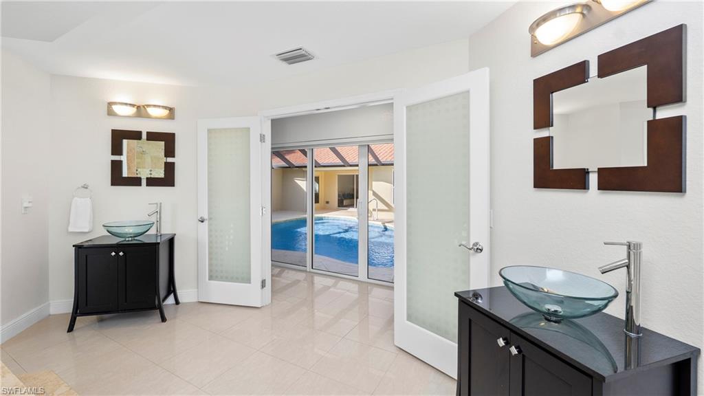 1580 16th Street Northeast Naples, FL 34120 - Photo 20 of 50 a view of bathroom with a sink and mirror