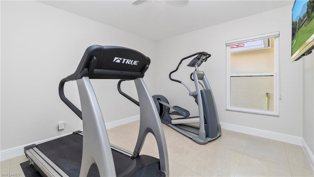 1580 16th Street Northeast Naples, FL 34120 - Photo 25 of 50 a picture of a room with gym equipment