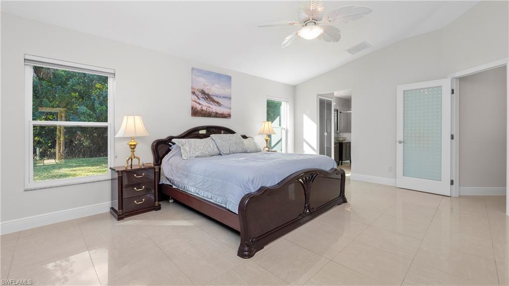 1580 16th Street Northeast Naples, FL 34120 - Photo 27 of 50 a living room with a bed furniture and a window