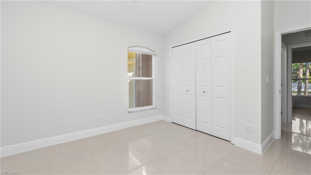 1580 16th Street Northeast Naples, FL 34120 - Photo 31 of 50 an empty room with windows