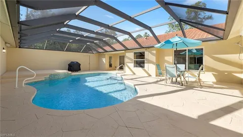 a view of a swimming pool with a patio
