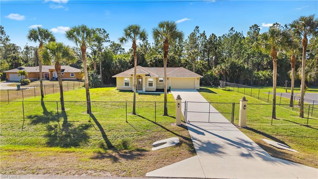 1580 16th Street Northeast Naples, FL 34120 - Photo 37 of 50 a view of a tennis ground with large trees