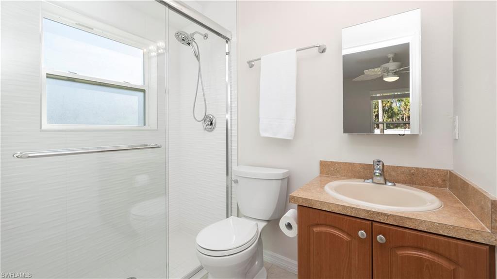 1580 16th Street Northeast Naples, FL 34120 - Photo 42 of 50 a bathroom with a granite countertop sink toilet and shower