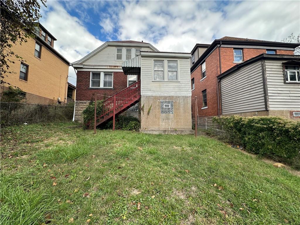 516 Cathedral Avenue Pittsburgh, PA 15210 - Photo 2 of 6 front view of a house with a yard