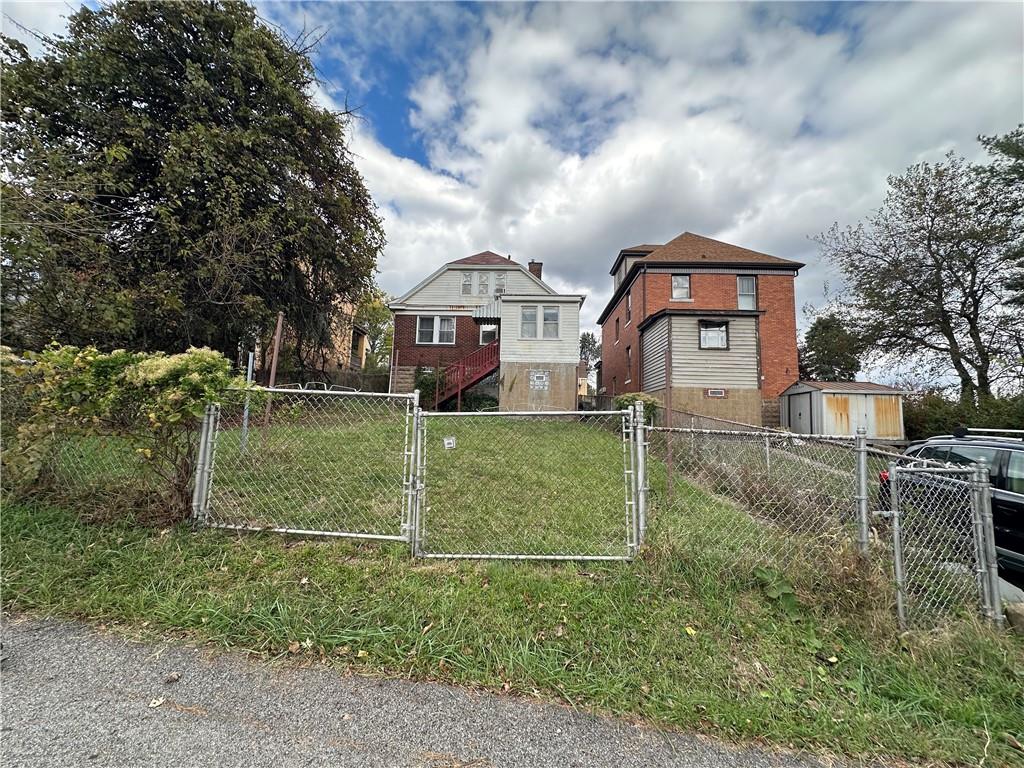 516 Cathedral Avenue Pittsburgh, PA 15210 - Photo 3 of 6 front view of house with a yard