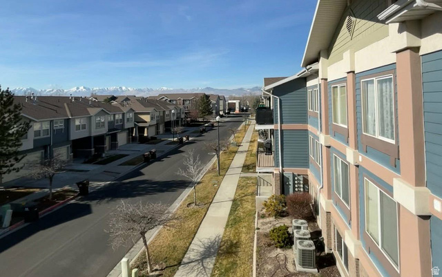 90 East Resaca Drive, Unit C11 Sandy, UT 84070 - Photo 17 of 27 View of asphalt road with sidewalks, curbs, and a residential view