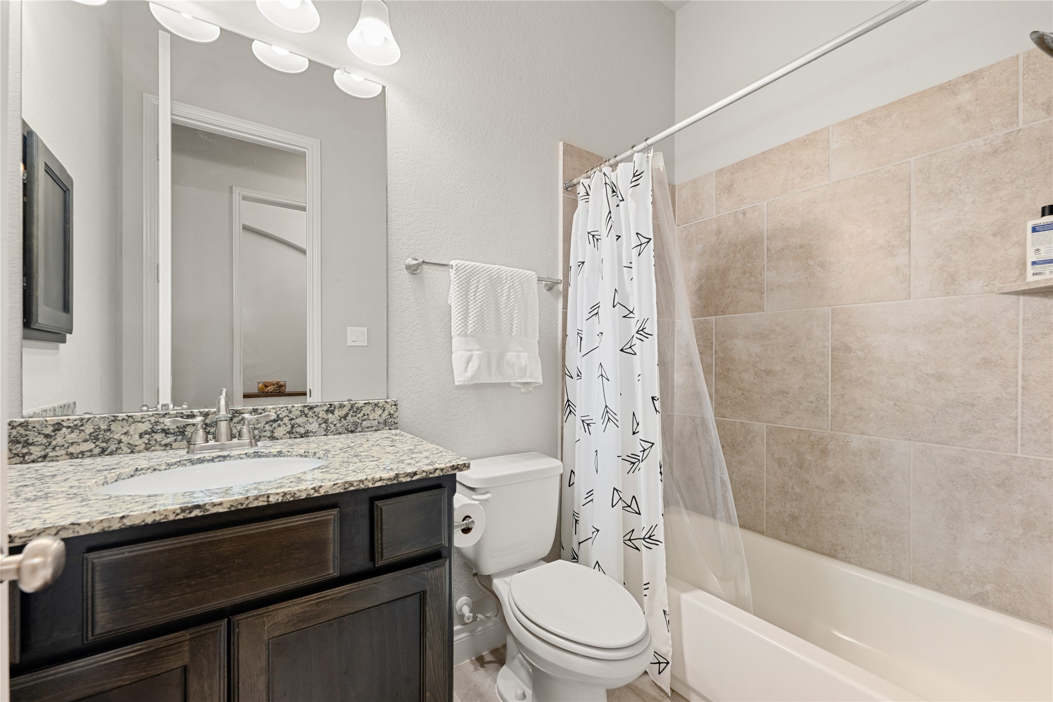 4103 August Light Court Fulshear, TX 77441 - Photo 20 of 33 a bathroom with a sink a toilet and shower