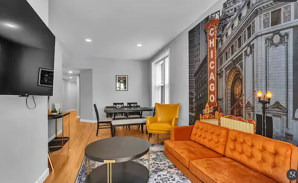 448 North Aberdeen Street, Unit 2 Chicago, IL 60642 - Photo 3 of 10 a living room with furniture a lamp and a table