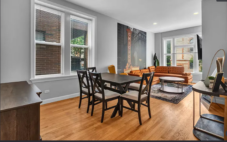 448 North Aberdeen Street, Unit 2 Chicago, IL 60642 - Photo 5 of 10 a dining room with furniture and wooden floor