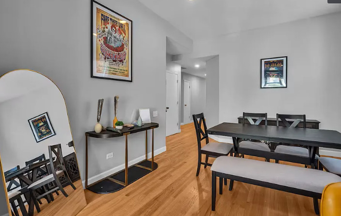 448 North Aberdeen Street, Unit 2 Chicago, IL 60642 - Photo 6 of 10 a view of a workspace with furniture and wooden floor