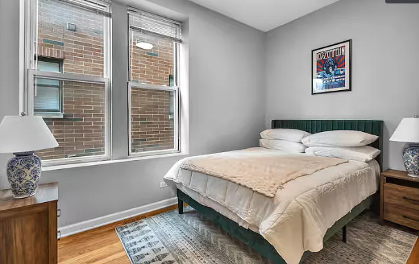 448 North Aberdeen Street, Unit 2 Chicago, IL 60642 - Photo 7 of 10 a bedroom with a bed and a window