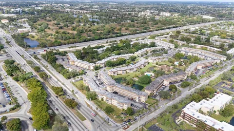 an aerial view of a residential houses with outdoor space