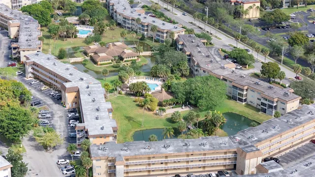 an aerial view of residential houses with city view