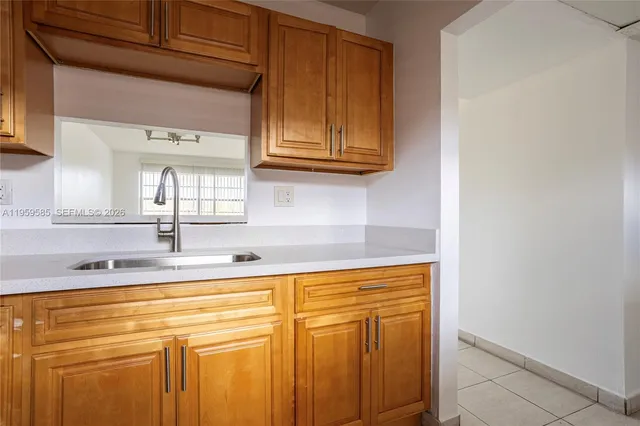 a bathroom with a sink and cabinets