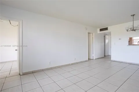 a view of an empty room and closet area