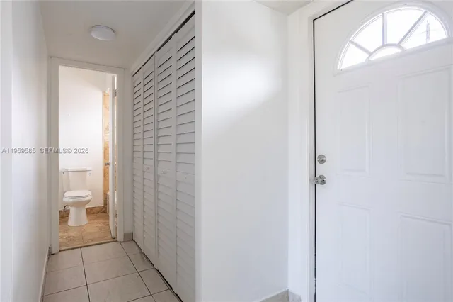 a bathroom with a granite countertop toilet and a shower