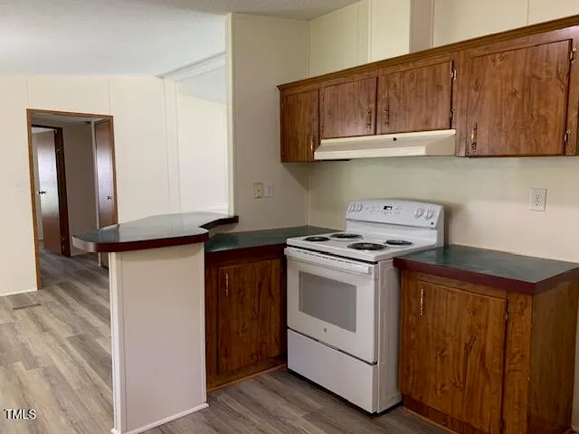 a kitchen with a stove and a microwave
