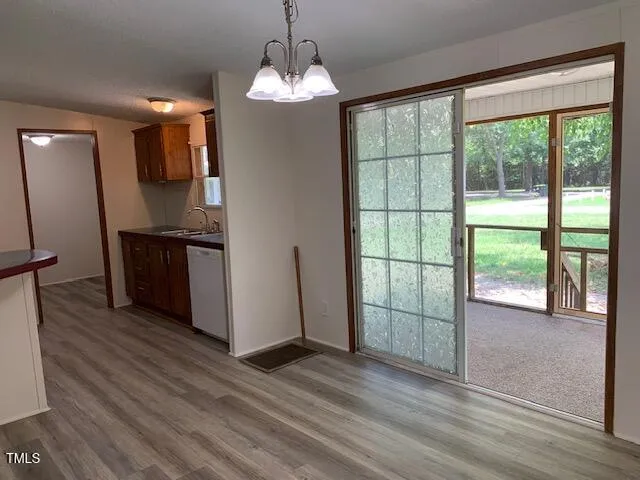 a view of a room window and wooden floor
