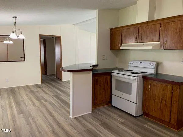 a kitchen with a stove and a microwave