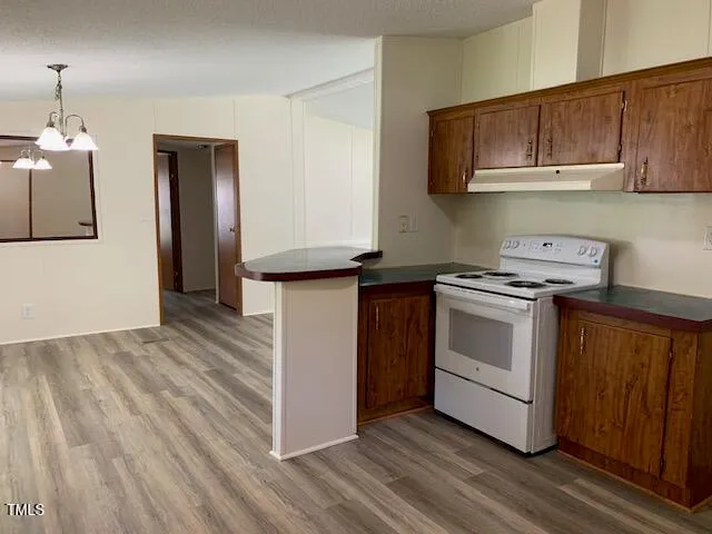 a kitchen with a stove and a microwave