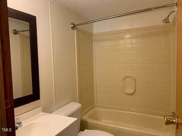 a bathroom with a shower curtain and a sink