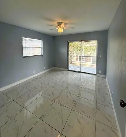 a view of an empty room with a window