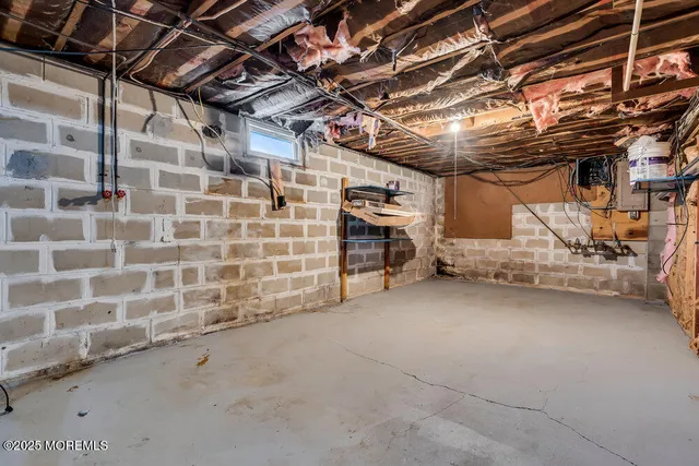 a view of empty room with wooden ceiling