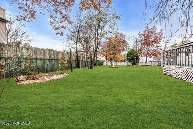 a view of a park with large trees