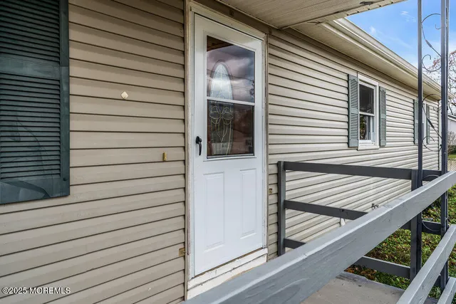 a view of a house with a door and a window