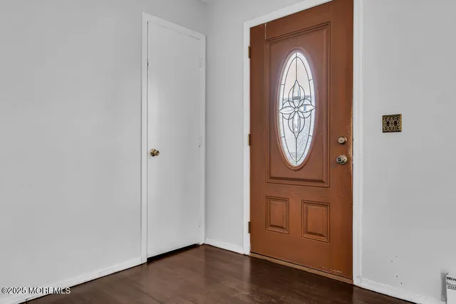 a front view of a house with wooden floor