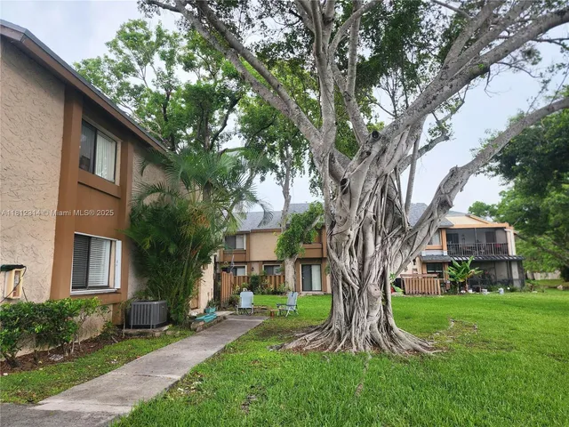 a view of a front of a house with a yard