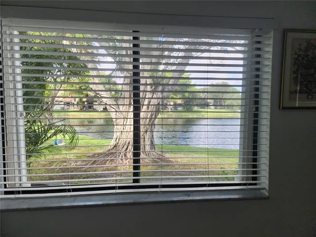 a living room with a couch and a window