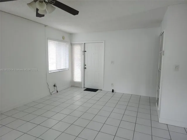 a view of a kitchen with a sink and cabinets