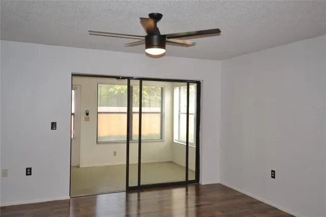 a view of a livingroom with wooden floor