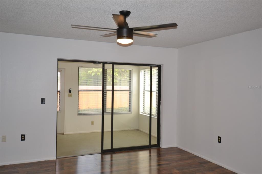 7331 Greystone Drive Hudson, FL 34667 - Photo 12 of 39 a view of a livingroom with wooden floor