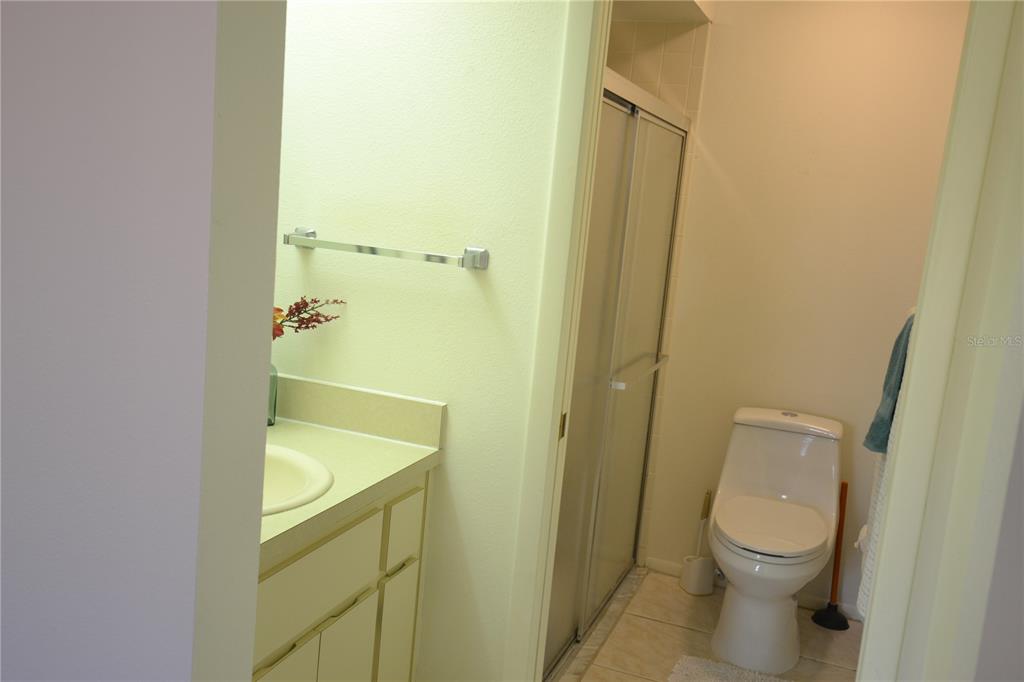 7331 Greystone Drive Hudson, FL 34667 - Photo 14 of 39 a bathroom with a granite countertop toilet and a sink