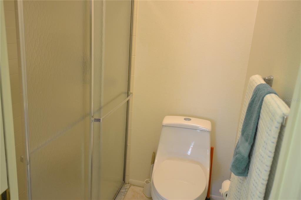 7331 Greystone Drive Hudson, FL 34667 - Photo 15 of 39 a bathroom with a toilet and mirror