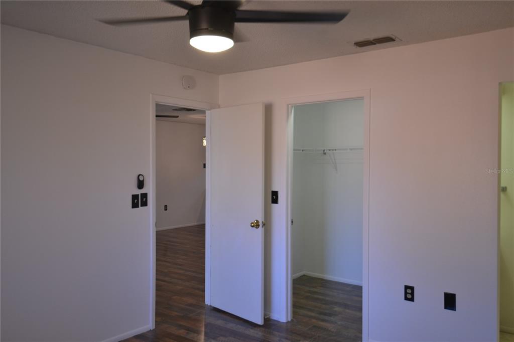 7331 Greystone Drive Hudson, FL 34667 - Photo 27 of 39 a view of a hallway with wooden floor