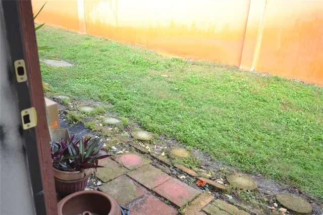 a view of a yard with an outdoor space