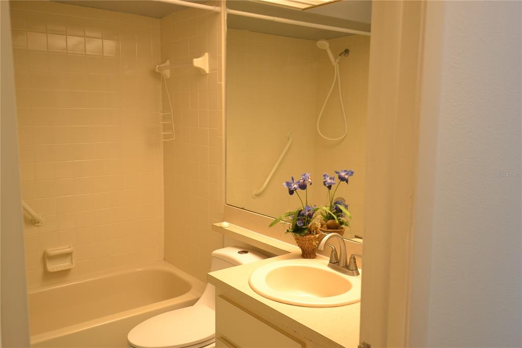 7331 Greystone Drive Hudson, FL 34667 - Photo 7 of 39 a bathroom with a granite countertop sink toilet and shower