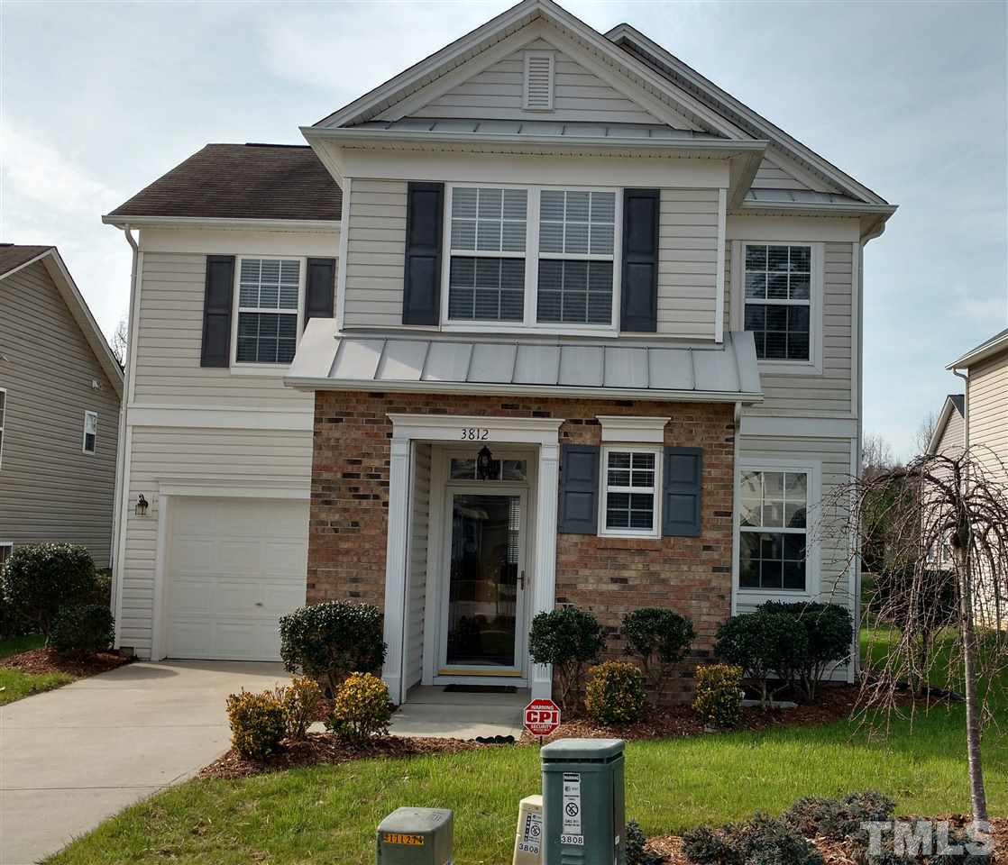 3812 Tryon Ridge Drive Raleigh, NC 27610 - Photo 3 of 23 a front view of a house with a yard and porch