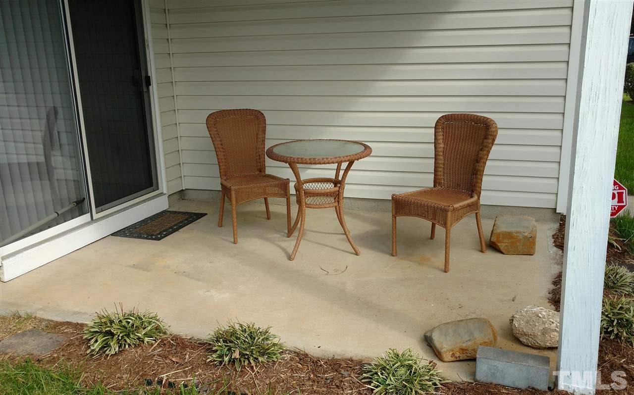 3812 Tryon Ridge Drive Raleigh, NC 27610 - Photo 23 of 23 a view of a chairs and table in backyard