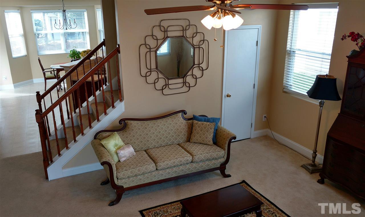 3812 Tryon Ridge Drive Raleigh, NC 27610 - Photo 5 of 23 a living room with furniture and a mirror